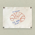 Un Croissant - Canvas & Grommet Wall Hanging